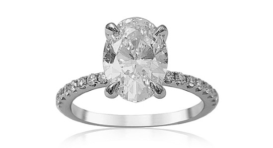  a white gold diamond engagement ring featuring an oval cut center diamond