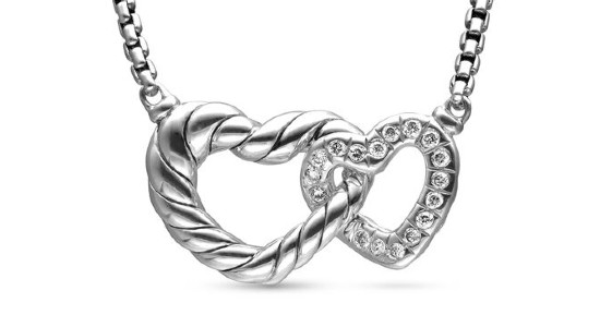a sterling silver necklace with two heart interlocking heart motifs with diamond details