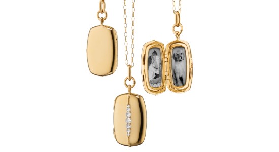 a yellow gold locket with diamond details