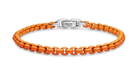 a David Yurman chain bracelet with orange links and a white gold clasp
