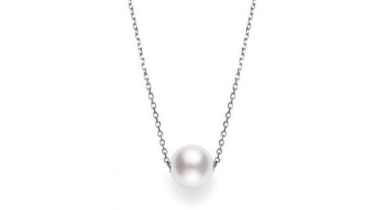 a white gold pendant necklace with a single pearl /