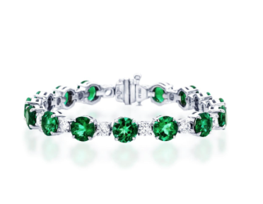 Platinum emerald and diamond bracelet handcrafted with perfectly matched 16 round emeralds and 16 round diamonds in prong setting. | Alson Jewelers