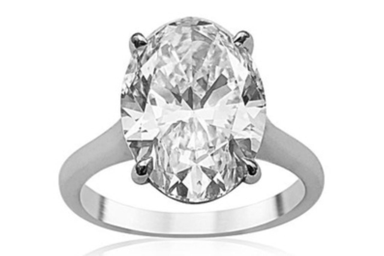 a platinum solitaire engagement ring with a large oval cut center diamond a platinum solitaire engagement ring with a large oval cut center diamond