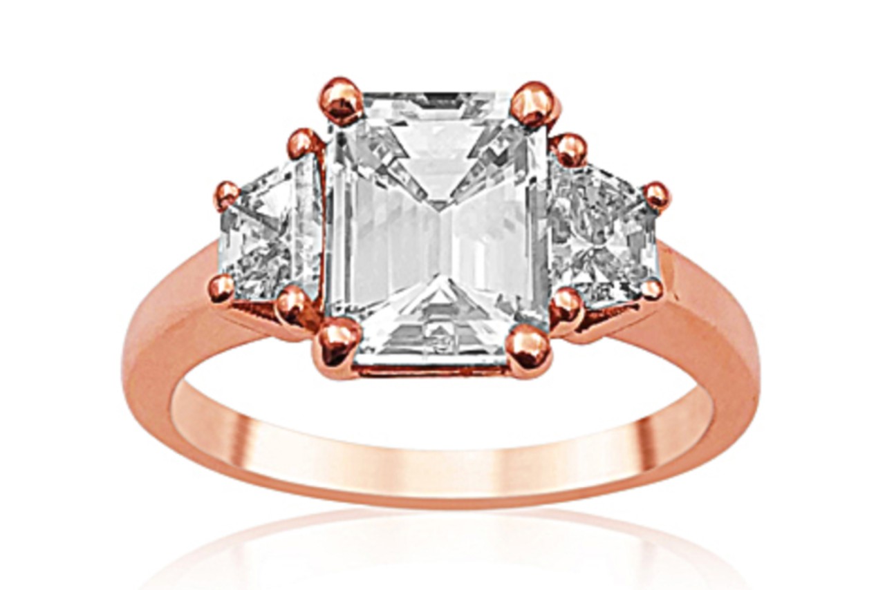 a three stone engagement ring in rose gold a three stone engagement ring in rose gold