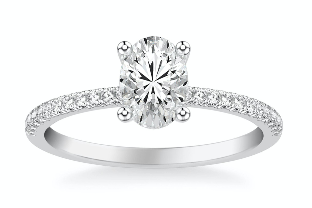 a white gold engagement ring with an oval cut diamond center stone a white gold engagement ring with an oval cut diamond center stone